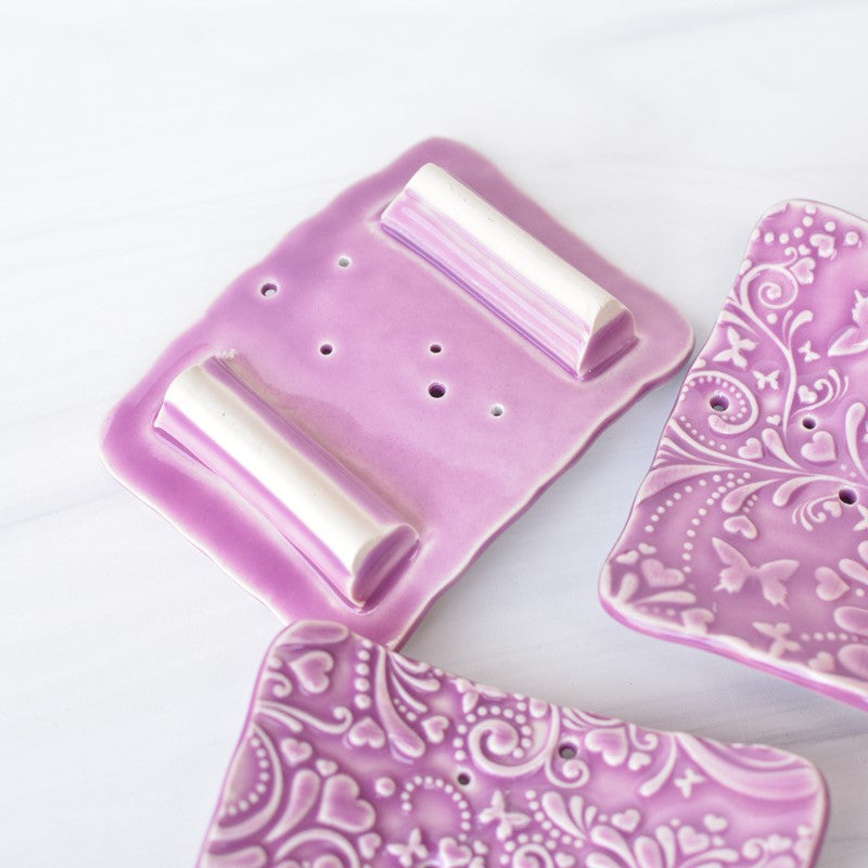 handmade purple ceramic soap dish underside view with feet