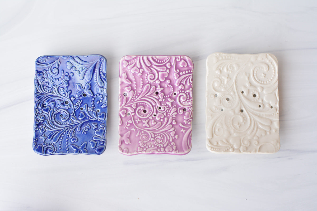 handmade purple ceramic soap dish, blue ceramic soap dish and white ceramic soap dish