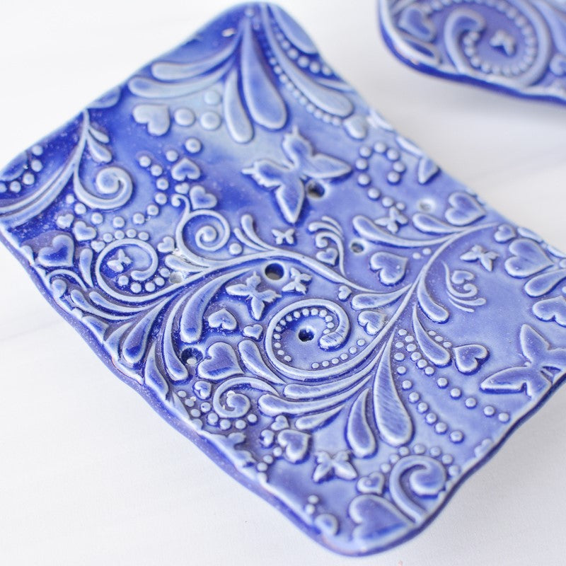 blue ceramic soap dishes made by bleu dog beads close up view