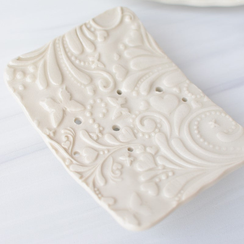 white ceramic soap dish made by bleu dog beads top view